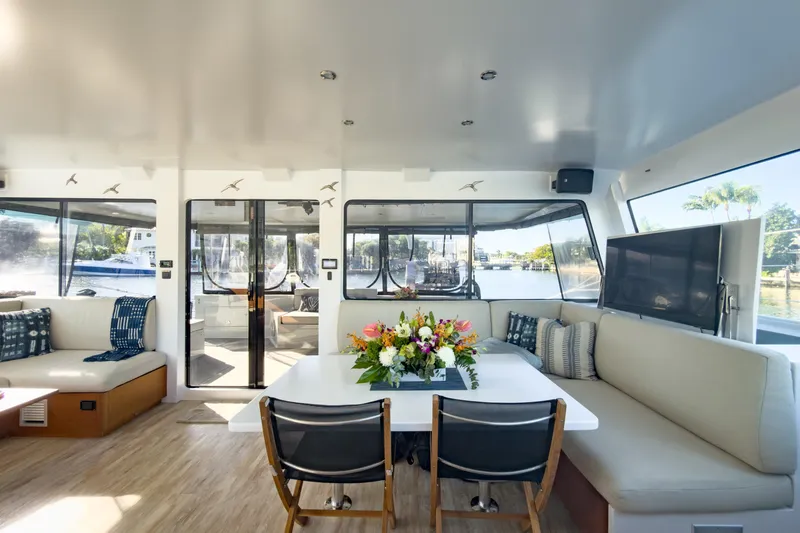 Slide: The Image of Luxurious interior of 2017 Harvey Yachts 58, featuring elegant seating and floral centerpiece. - 53