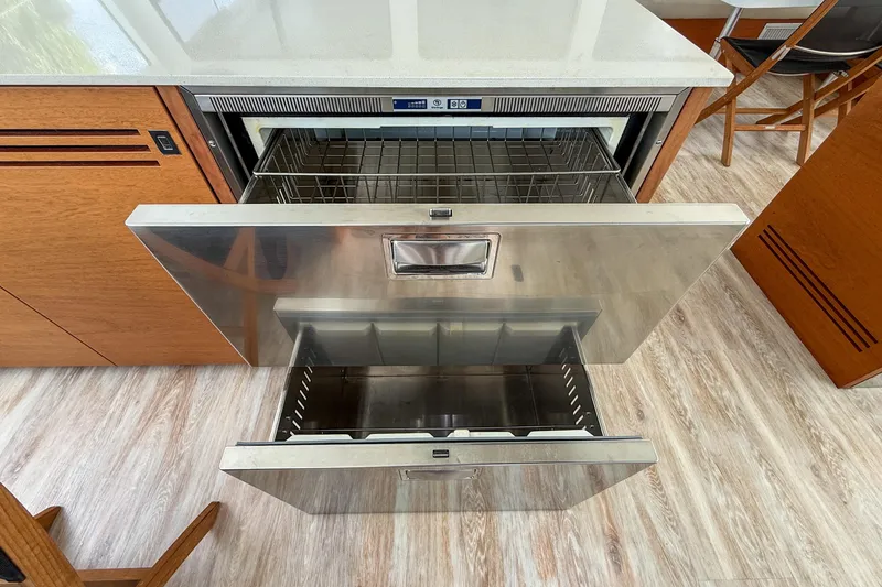 Slide: The Image of Stainless steel dishwasher drawers in a 2017 Harvey Yachts 58 kitchen. - 54