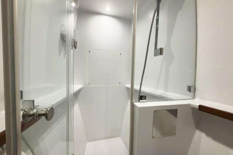 Slide: The Image of Modern shower area in 2017 Harvey Yachts 58, featuring sleek design and glass door. - 64