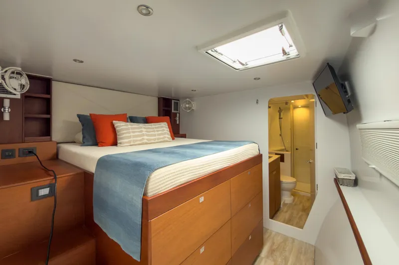 Slide: The Image of Luxurious cabin interior of 2017 Harvey Yachts 58, featuring a cozy bed and modern bathroom. - 66