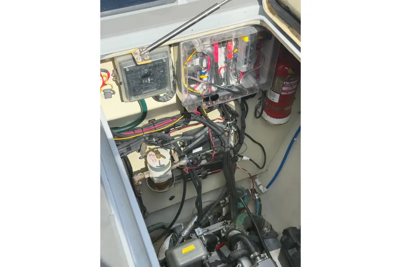 Slide: The Image of Engine compartment of a 2017 Harvey Yachts 58, showcasing wiring and fire extinguisher. - 79