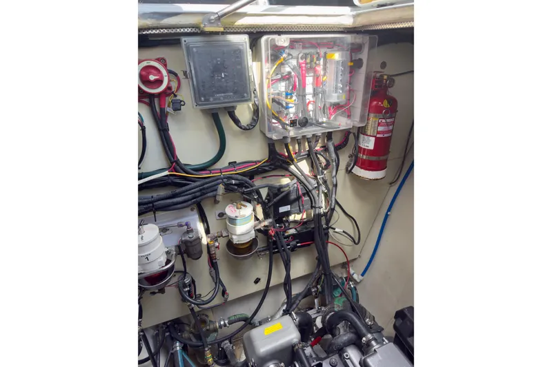 Slide: The Image of Engine room of 2017 Harvey Yachts 58, showcasing wiring and fire extinguisher. - 81