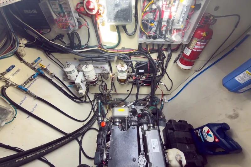 Slide: The Image of Engine room of a 2017 Harvey Yachts 58, showcasing wiring and equipment. - 84