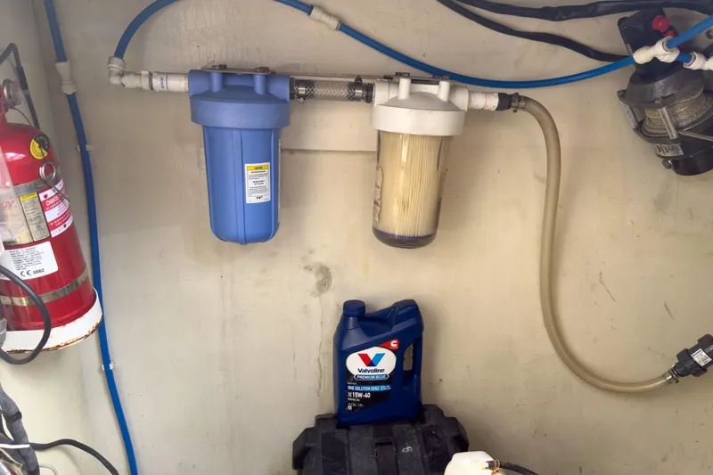 Slide: The Image of Engine room of 2017 Harvey Yachts 58 with filters and fire extinguisher. - 86