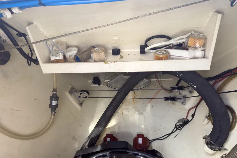 Slide: The Image of Engine compartment of a 2017 Harvey Yachts 58, showing hoses and components. - 88