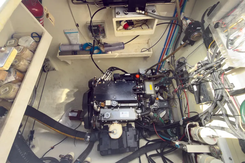 Slide: The Image of Engine room of a 2017 Harvey Yachts 58, showcasing intricate wiring and components. - 89