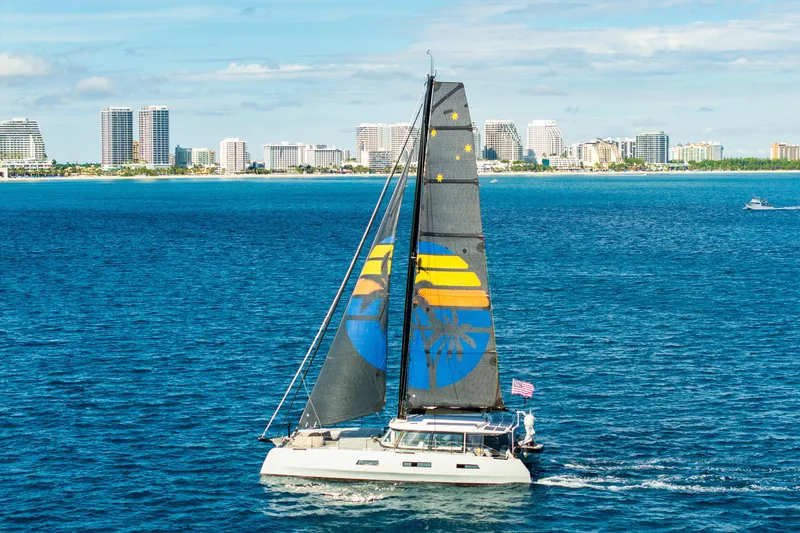 Slide: The Image of 2017 Harvey Yachts 58 sailing near a coastal city skyline. - 9