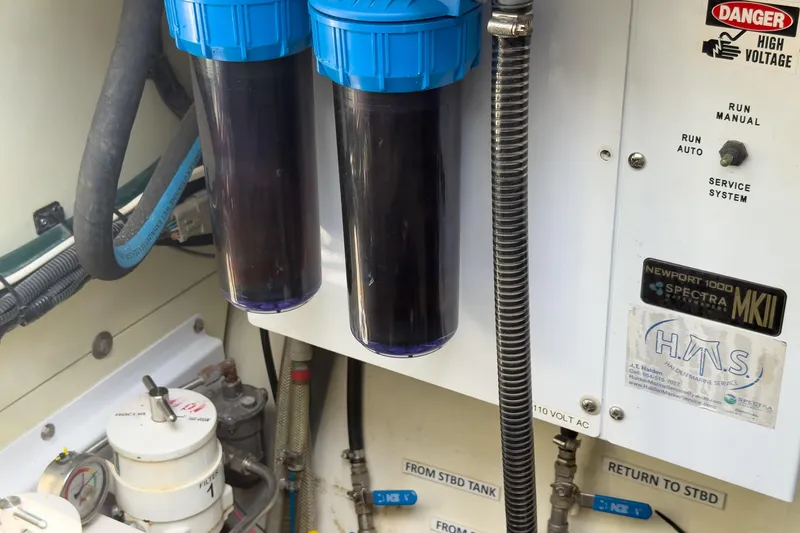 Slide: The Image of Engine room of 2017 Harvey Yachts 58 with water filtration system and control panel. - 94