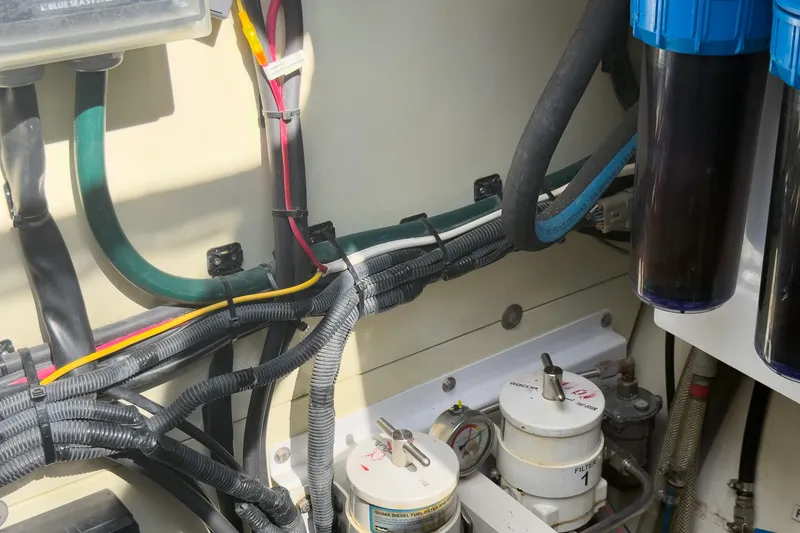 Slide: The Image of Engine room of 2017 Harvey Yachts 58, showcasing wiring and filtration systems. - 95