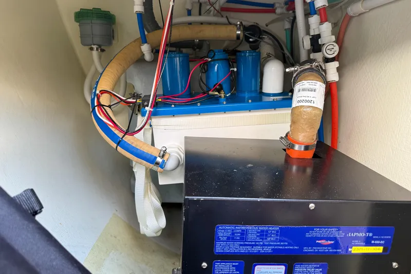 Slide: The Image of Engine room of 2017 Harvey Yachts 58 with visible wiring and components. - 97