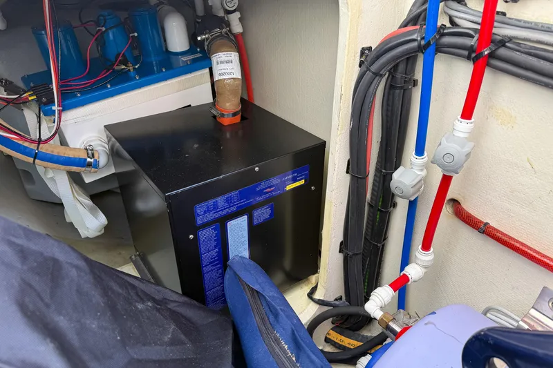 Slide: The Image of Engine room of 2017 Harvey Yachts 58, featuring wiring and equipment. - 98