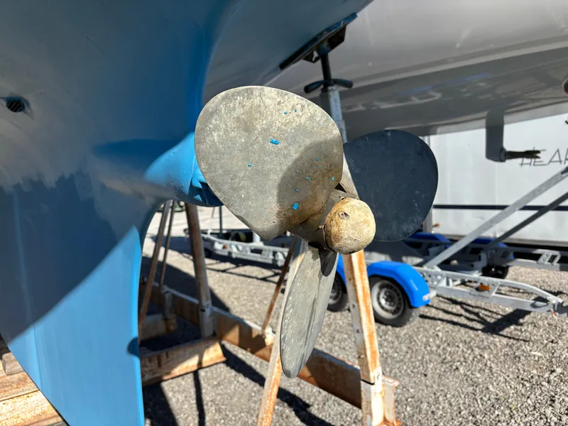 Slide: The Image of Propeller of a 1979 Hallberg-Rassy 38 sailboat on a stand, close-up view. - 14