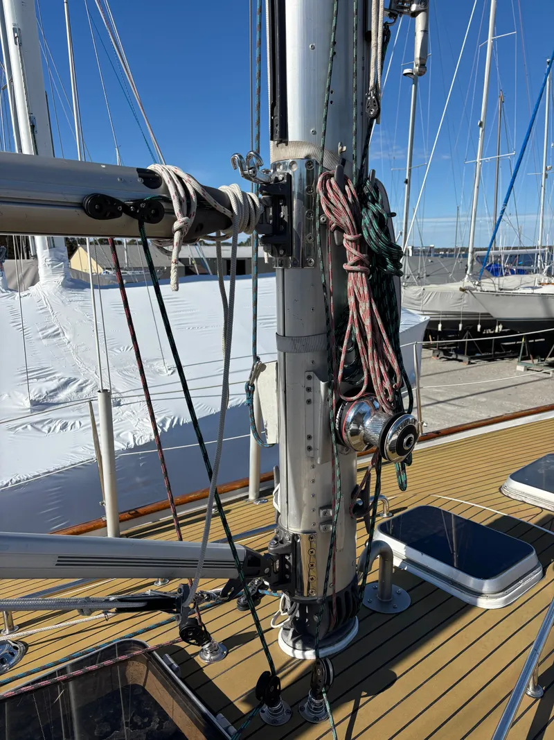Slide: The Image of 1979 Hallberg-Rassy 38 sailboat mast with rigging and ropes on deck. - 28