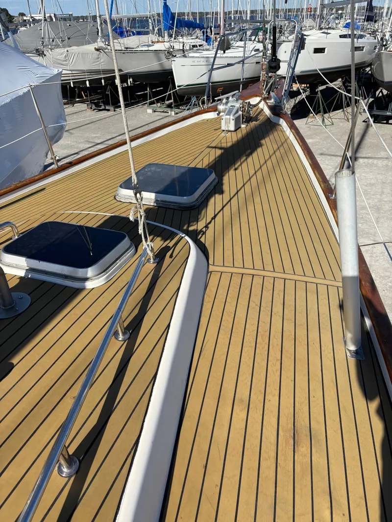 Slide: The Image of Deck of a 1979 Hallberg-Rassy 38 sailboat with wooden finish and hatches. - 29