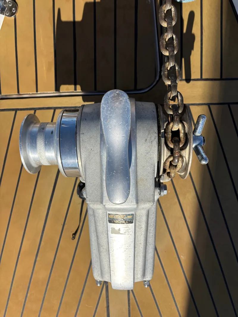 Slide: The Image of Anchor windlass on 1979 Hallberg-Rassy 38 yacht deck with chain. - 33