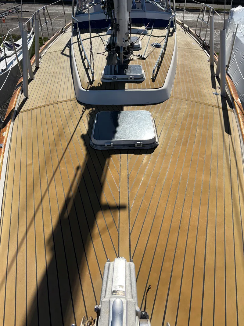 Slide: The Image of Deck view of a 1979 Hallberg-Rassy 38 sailboat with teak finish and hatch. - 35