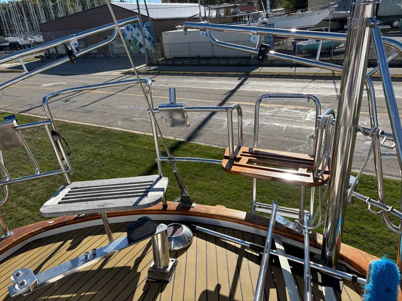 Slide: The Image of Stern view of a 1979 Hallberg-Rassy 38 sailboat with stainless steel fittings. - 49