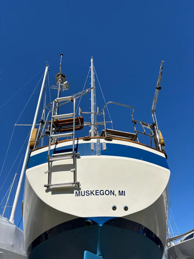 Slide: The Image of 1979 Hallberg-Rassy 38 sailboat, Muskegon, MI, viewed from stern against clear blue sky. - 7