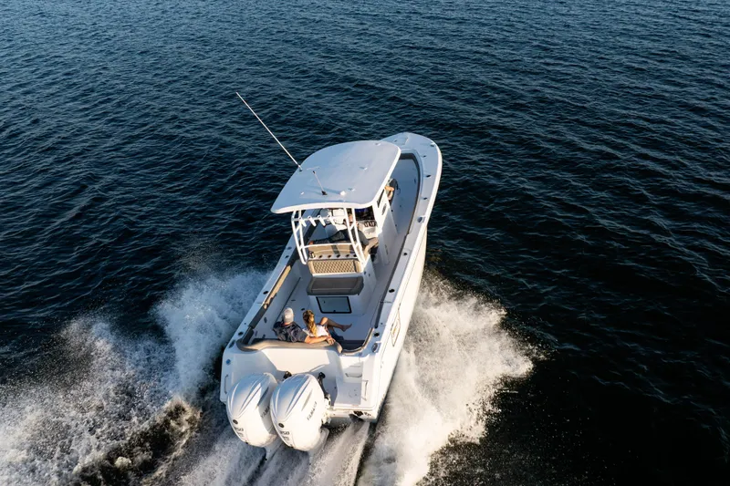 The Image of 2026 Sea Hunt Ultra 305 Coffin Box cruising on open water, rear view. - 0