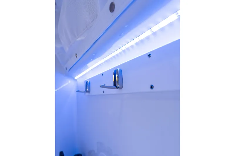Slide: The Image of Interior view of 2026 Sea Hunt Ultra 305 Coffin Box with LED lighting. - 34