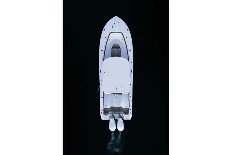Slide: The Image of Aerial view of 2026 Sea Hunt Ultra 305 Coffin Box boat on dark water. - 39