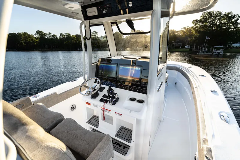 Slide: The Image of 2026 Sea Hunt Ultra 305 Coffin Box boat interior with advanced navigation system. - 4