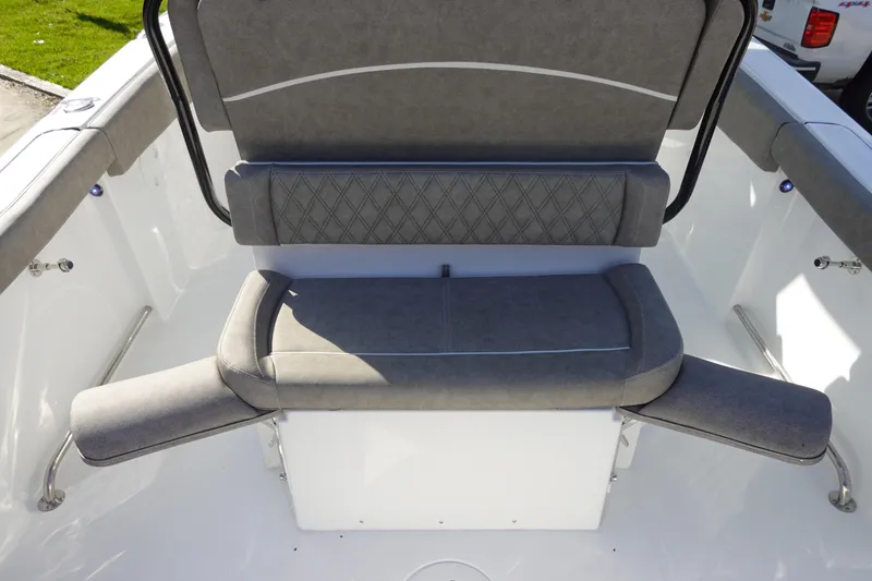 Slide: The Image of 2026 Sea Hunt Ultra 255 SE boat seating area with gray cushioned seats. - 15