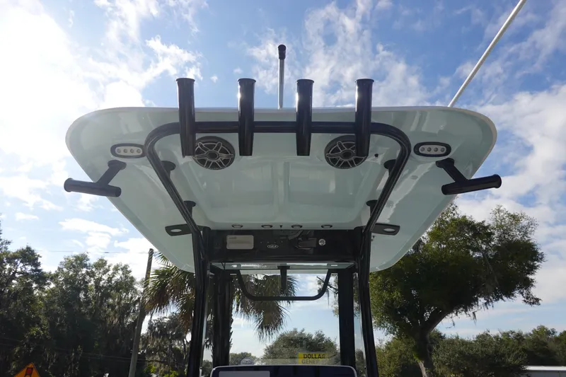 Slide: The Image of 2026 Sea Hunt Ultra 255 SE boat top view with rod holders and speakers. - 17