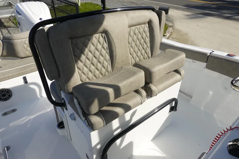 Slide: The Image of 2026 Sea Hunt Ultra 255 SE boat seating with cushioned, diamond-stitched design. - 18