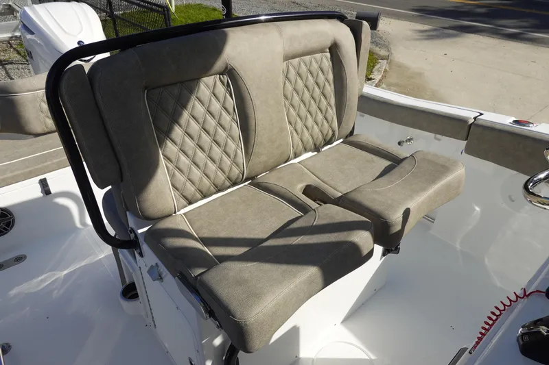 Slide: The Image of 2026 Sea Hunt Ultra 255 SE boat seating with beige upholstery and diamond stitching. - 19