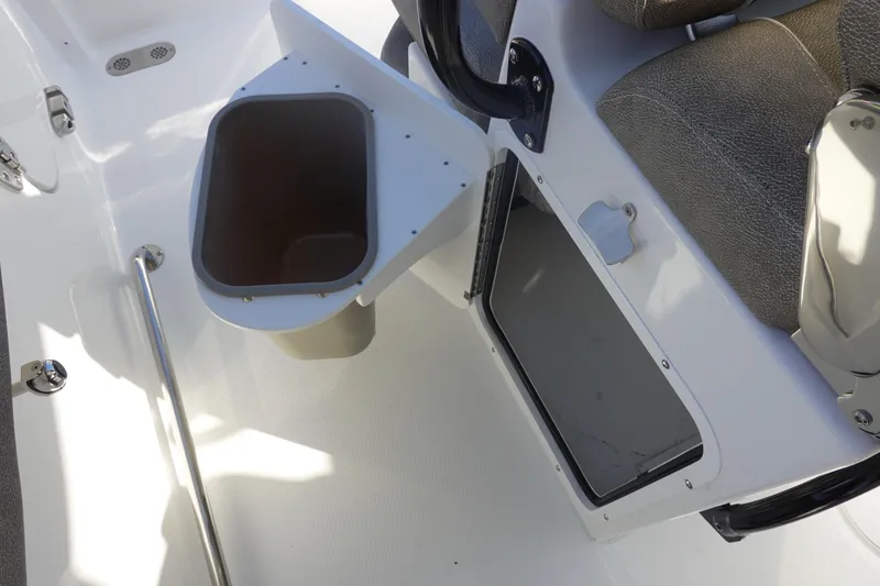 Slide: The Image of Interior view of 2026 Sea Hunt Ultra 255 SE boat, featuring seating and storage compartments. - 20