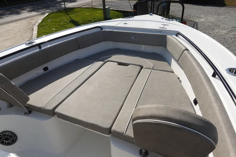 Slide: The Image of 2026 Sea Hunt Ultra 255 SE boat with spacious cushioned seating area. - 29