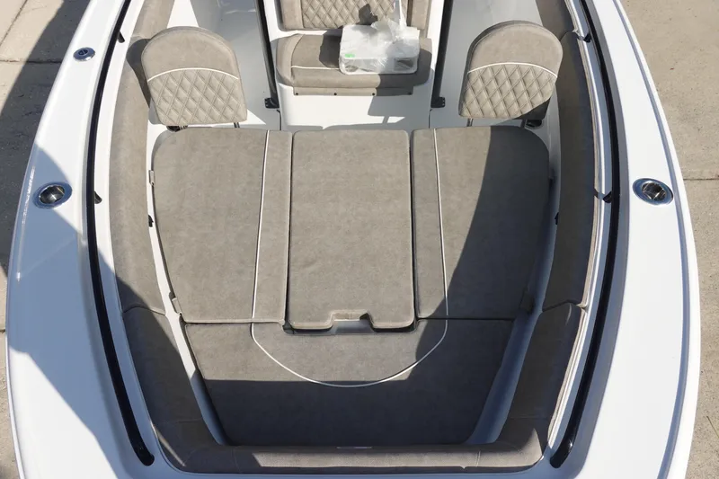 Slide: The Image of 2026 Sea Hunt Ultra 255 SE boat interior with cushioned seating and sleek design. - 30