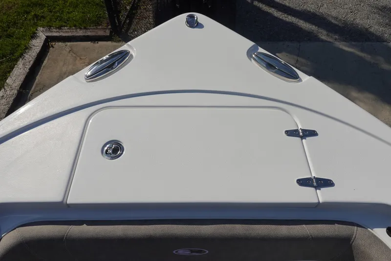 Slide: The Image of Bow of 2026 Sea Hunt Ultra 255 SE boat with storage hatch and cleats. - 36
