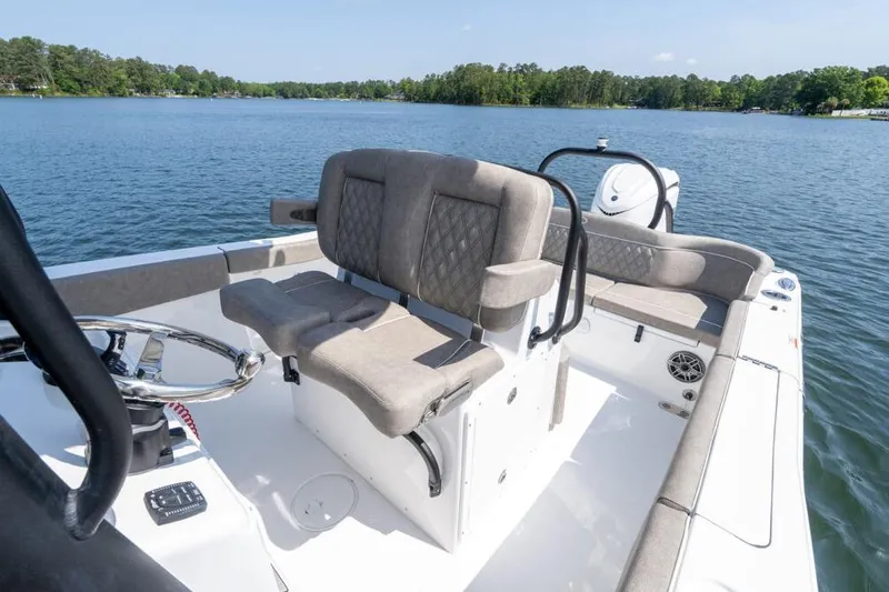 Slide: The Image of 2026 Sea Hunt Ultra 255 SE boat on trailer, parked outdoors under clear sky. - 4