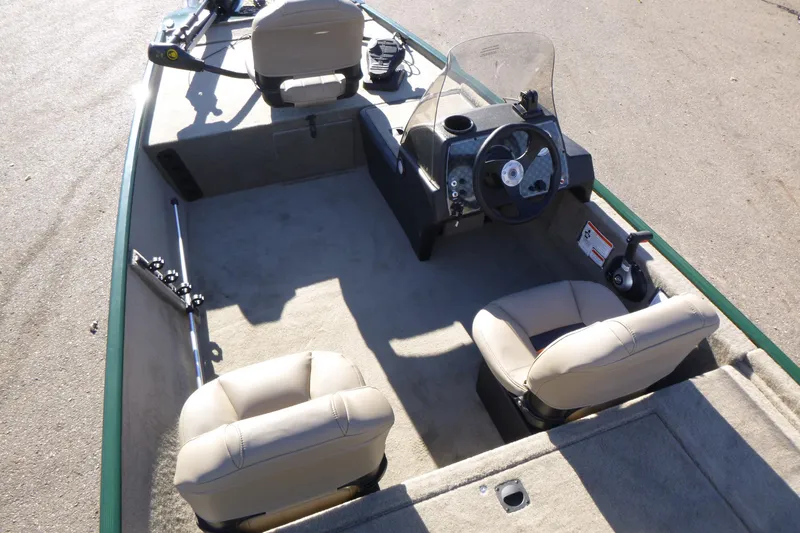 Slide: The Image of 2026 Tracker Bass Tracker Classic Limited boat interior with steering console and seating. - 10