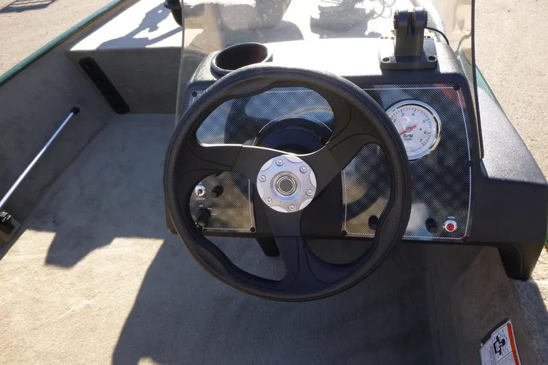 Slide: The Image of 2026 Tracker Bass Tracker Classic Limited boat steering wheel and dashboard. - 16
