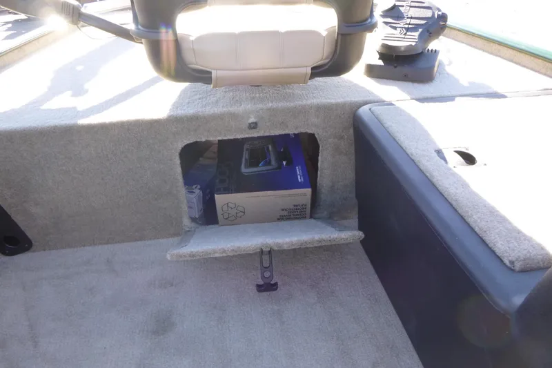 Slide: The Image of 2026 Tracker Bass Tracker Classic Limited boat interior storage compartment. - 18