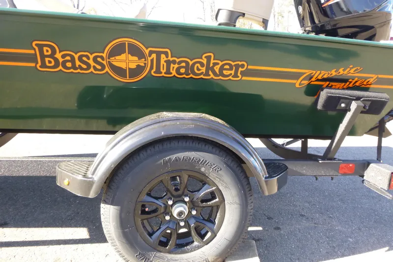 Slide: The Image of 2026 Tracker Bass Tracker Classic Limited boat with trailer, side view. - 3