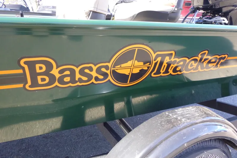Slide: The Image of 2026 Tracker Bass Tracker Classic Limited boat logo on green hull. - 4