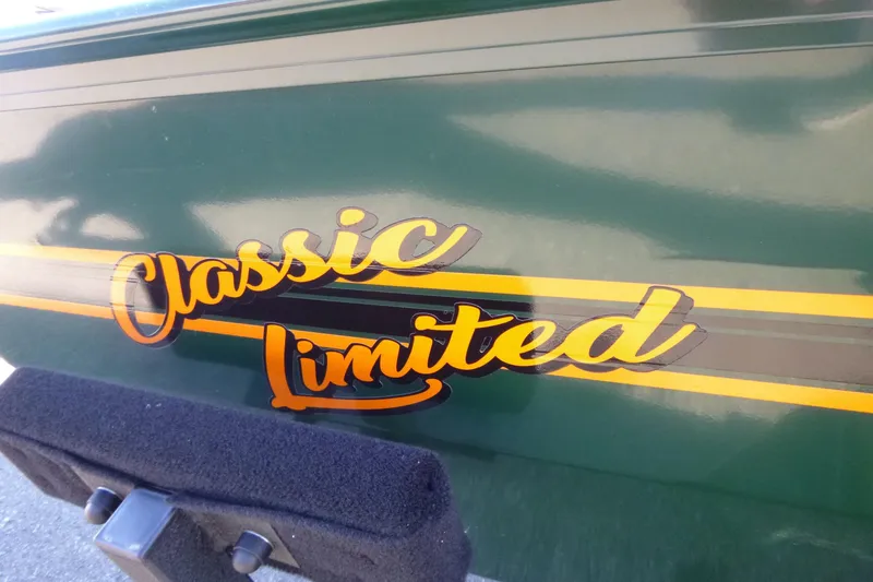 Slide: The Image of 2026 Tracker Bass Tracker Classic Limited boat decal on green surface. - 5