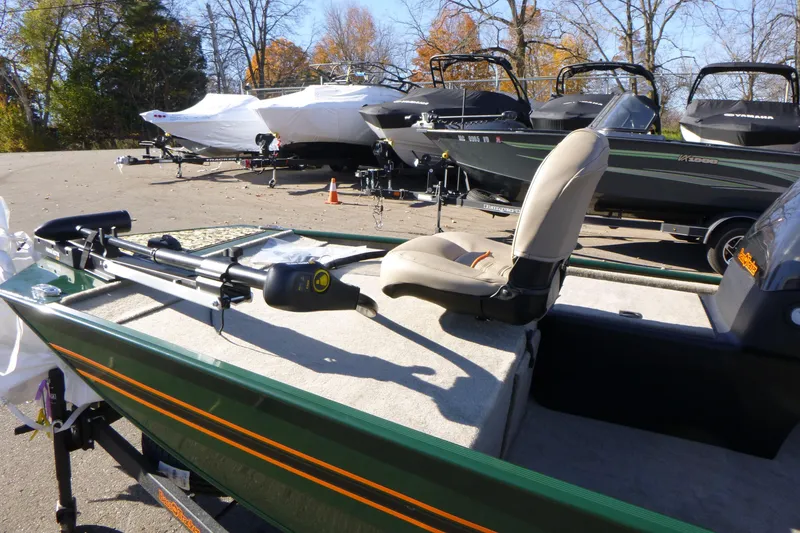Slide: The Image of 2026 Tracker Bass Tracker Classic Limited boat parked outdoors in a lot. - 9