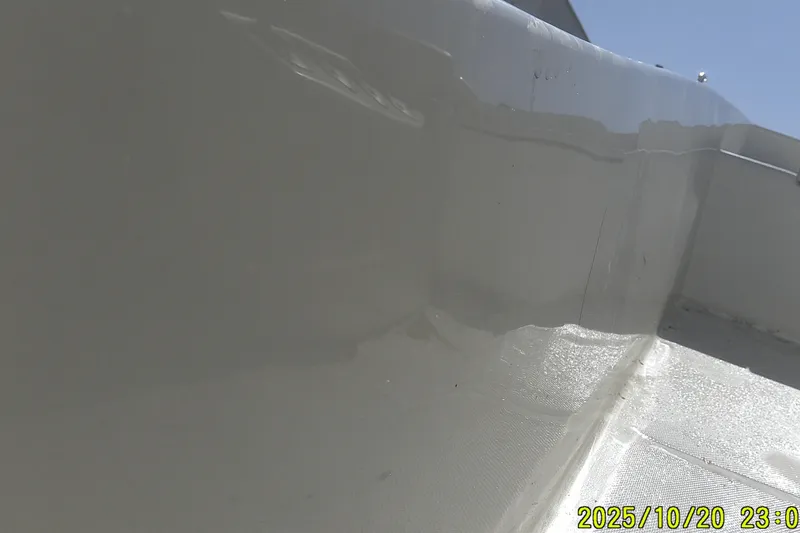 Slide: The Image of Close-up of 2025 Mako Pro Skiff 15 CC boat interior, showing sleek white surface. - 4