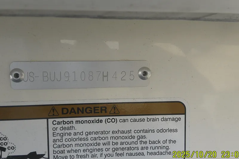 Slide: The Image of 2025 Mako Pro Skiff 15 CC hull identification and carbon monoxide warning label. - 5