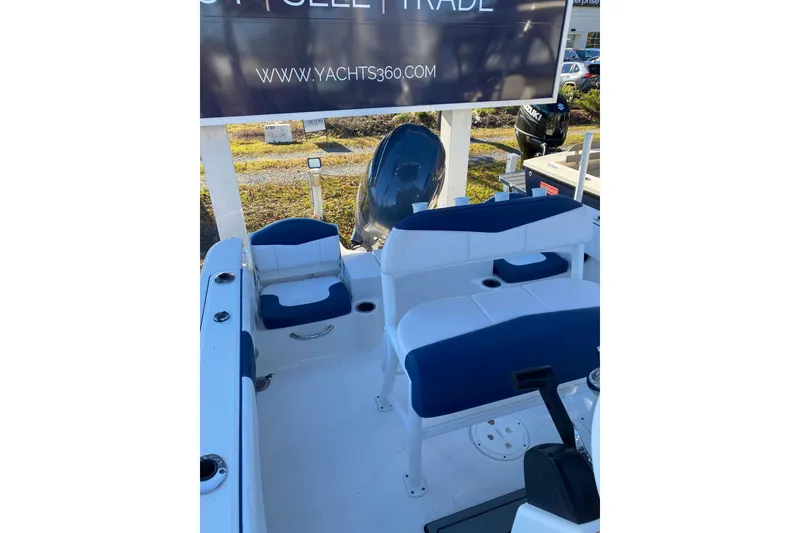 Slide: The Image of 2021 Robalo R180 Center Console boat cruising on calm waters. - 4