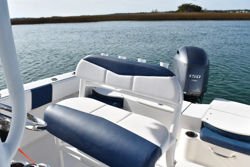 Slide: The Image of 2021 Robalo R180 Center Console boat with Yamaha 150 engine on calm water. - 8