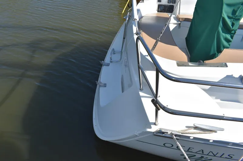 Slide: The Image of Beneteau Oceanis 321 sailboat, 1996 model, docked with visible deck and railing. - 10