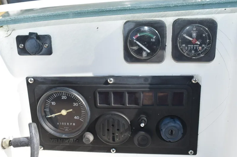 Slide: The Image of Control panel of a 1996 Beneteau Oceanis 321 sailboat with gauges and switches. - 14
