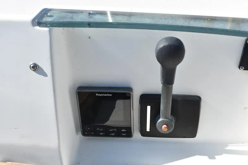 Slide: The Image of Control panel of 1996 Beneteau Oceanis 321 with Raymarine display and throttle lever. - 15