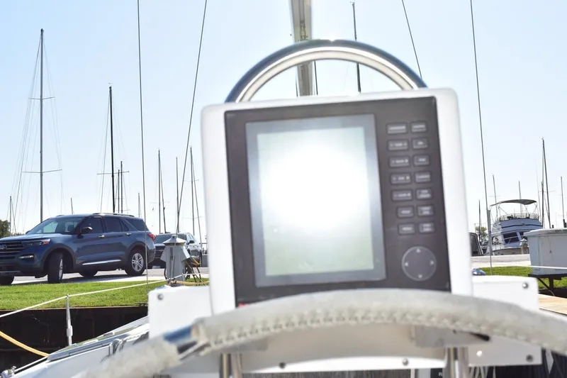 Slide: The Image of Steering wheel and navigation system on 1996 Beneteau Oceanis 321 sailboat at marina. - 16